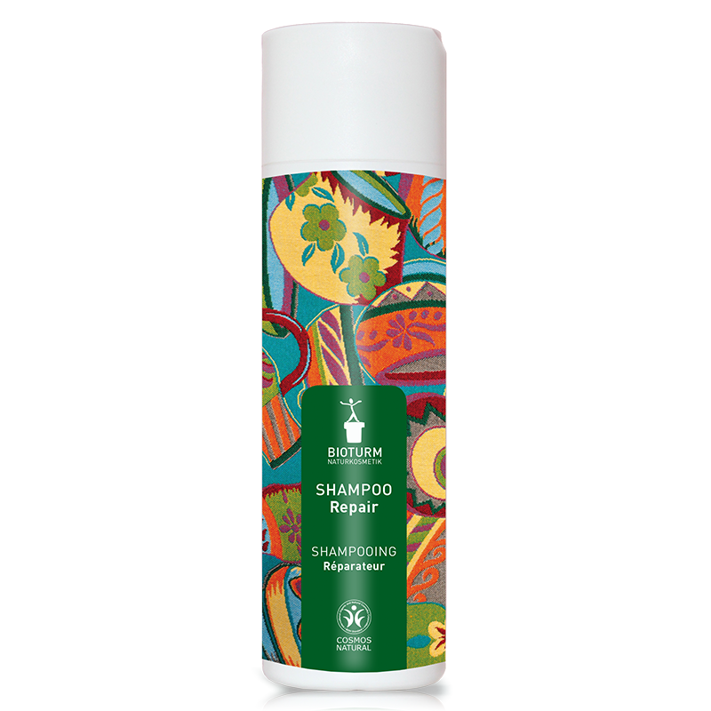 Eine Darstellung des Repair Shampoo: Die Verpackung zeigt Pflegende Reinigung bei angegriffenem und strapaziertem Haar.