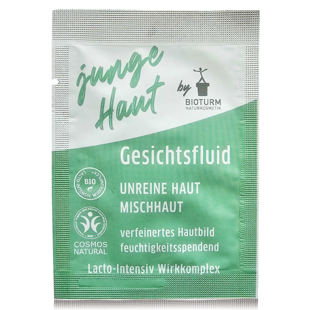 Ein Probesachet mit einem Gesichtsfluid für junge, unreine Haut. Die Verpackung zeigt dezente Farben und den Produktnamen. Das Fluid enthält Aloe Vera für Feuchtigkeit und Bio-Honig zur Beruhigung der Haut.